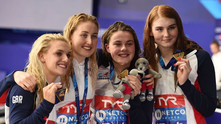 Britain's Eleanor Faulkner, Britain's Kathryn Greenslade Britain's Holly Hibbott and Britain's Freya Anderson pose on the podium during the medal ceremony for the Women's 4x200m freestyle relay swimming final at the Tollcross swimming centre during the 2018 European Championships in Glasgow