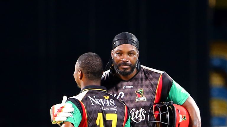 BRIDGETOWN, BARBADOS - SEPTEMBER 03: In this handout image provided by CPL T20, Chris Gayle (R) and Evin Lewis (L) of the St Kitts and Nevis Patriots during Match 30 of the 2017 Hero Caribbean Premier League between Barbados Tridents v St Kitts and Nevis Patriots at Kensington Oval on September 3, 2017 in Bridgetown, Barbados. (Photo by Ashley Allen - CPL T20 via Getty Images) *** Local Caption *** Chris Gayle, Evin Lewis.. 