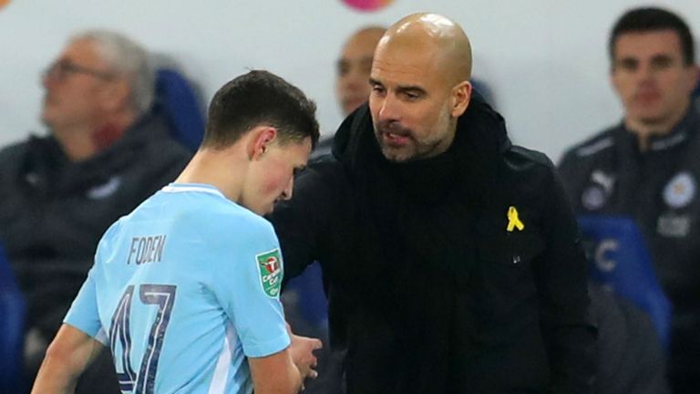 Pep Guardiola the head coach / manager of Manchester City and Phil Foden of Manchester City during the Carabao Cup Quarter-Final match between Leicester City and Manchester City at The King Power Stadium on December 19, 2017 in Leicester, England. 