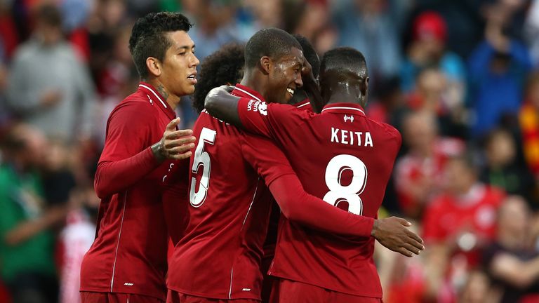 Georginio Wijnaldum of Liverpool celebrates his goal with team-mates during the pre-season friendly match between Liverpool and Torino at Anfield on August 7, 2018 in Liverpool, England