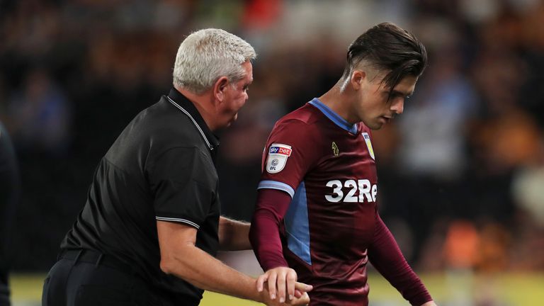 Jack Grealish shakes hands with manager Steve Bruce as he is substituted at Hull.
