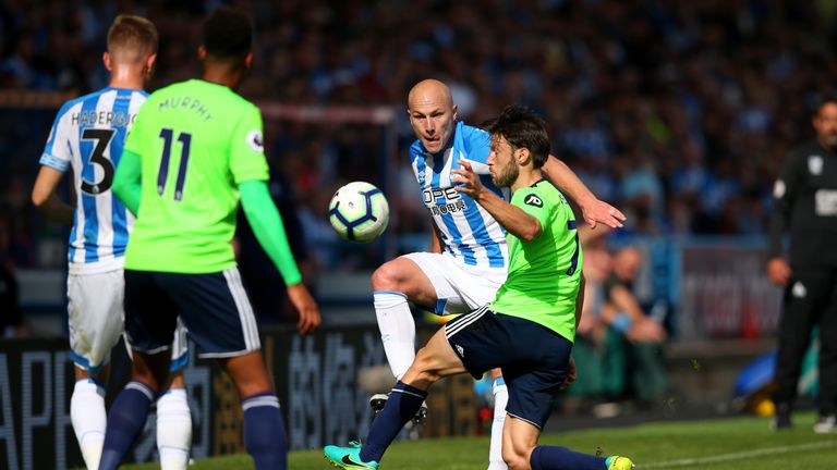 Harry Arter and Aaron Mooy in action at the John Smith's Stadium