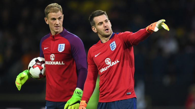 Joe Hart of England (L) and Thomas Heaton of England (R) speak while they warm up prior to the international friendly match between Germany and England at Signal Iduna Park on March 22, 2017 in Dortmund, Germany.