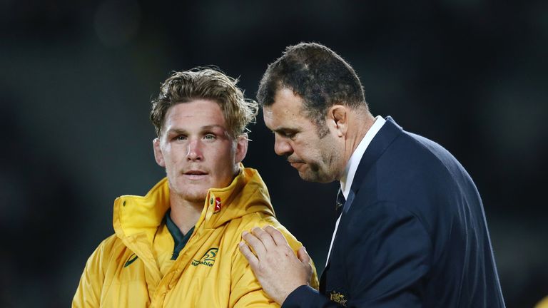 Australia skipper Michael Hooper and head coach Michael Cheika look on after the defeat