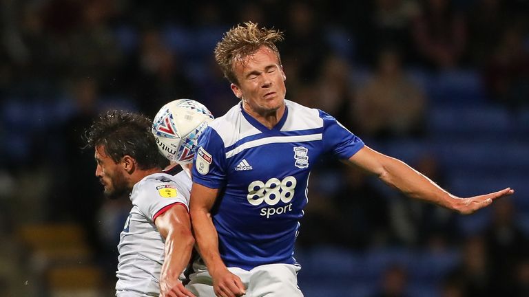 Bolton Wanderers' Jason Lowe competing with Birmingham City's Maikel Kieftenbeld during the Sky Bet Championship match between Bolton Wanderers and Birmingham City at Macron Stadium on August 22, 2018 in Bolton, England