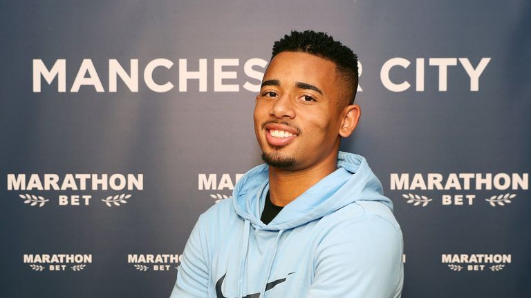 Gabriel Jesus poses after signing a contract extension at Manchester City