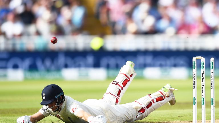 Joe Root of England dives into his crease but is run out by Virat Kohli of India during day one of the Specsavers 1st Test match between England and India at Edgbaston on August 1, 2018 in Birmingham, England. (Photo by Nathan Stirk/Getty Images)