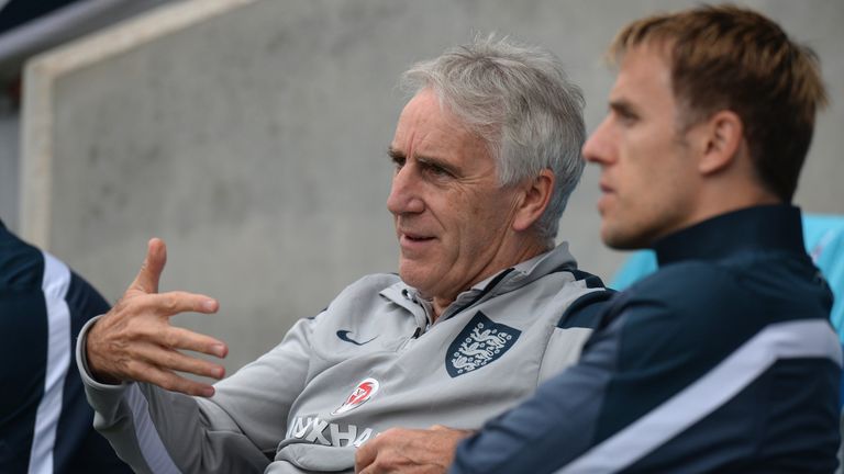 John Peacock and Phil Neville in conversation during the Under 17 International match between England U17 and Portugal U17 at Proact Stadium on August 29, 2014 in Chesterfield, England.
