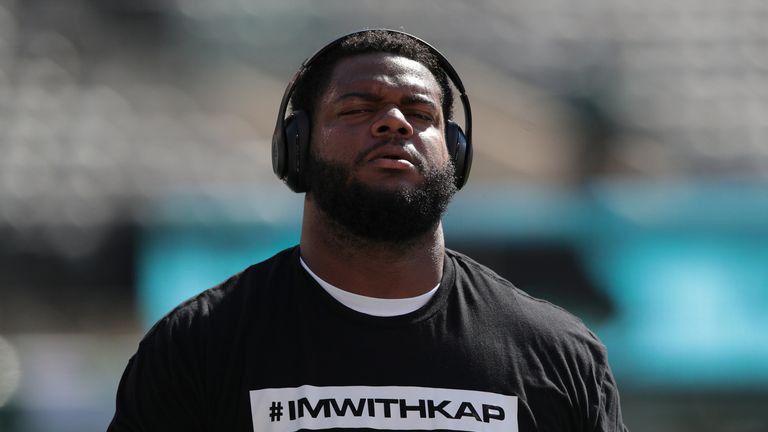 Jordan Phillips #97 of the Miami Dolphins wears a t-shirt in support of former quarterback Colin Kaepernick before a game against of the New York Jets at MetLife Stadium on September 24, 2017 in East Rutherford, New Jersey. (Photo by Rich Schultz/Getty Images)