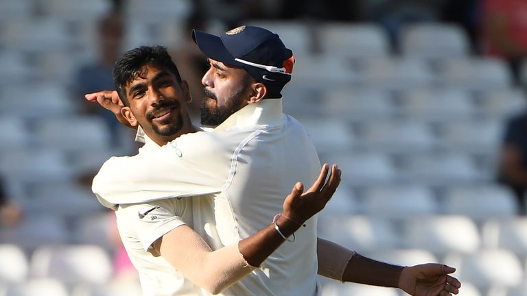 India's Jasprit Bumrah (L) celebrates with India's Lokesh Rahul after taking the wicket of England's Jos Buttler for 106 during the fourth day of the third Test cricket match between England and India at Trent Bridge in Nottingham