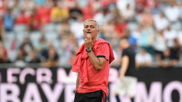 Jose Mourinho watches his team warm up prior to the pre-season friendly against Bayern Munich