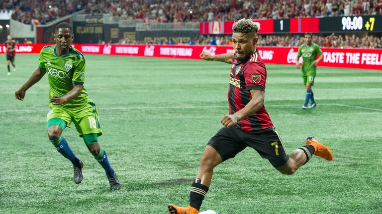 Josef Martinez #7 of Atlanta United takes a shot in front of Kelvin Leerdam #18 of Seattle Sounders FC 2 during the game at Mercedes-Benz Stadium on July 15, 2018 in Atlanta, Georgia