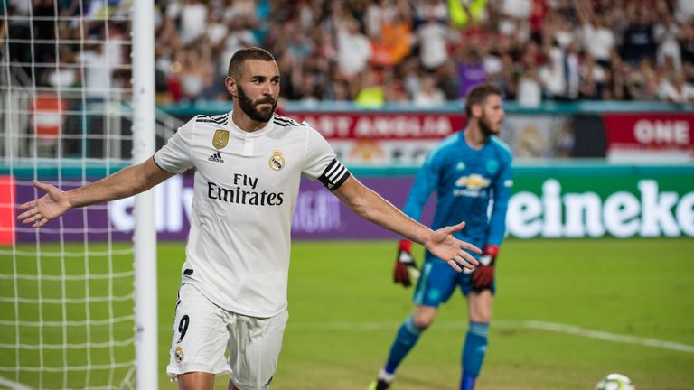 Karim Benzema wheels away after scoring against Manchester United.