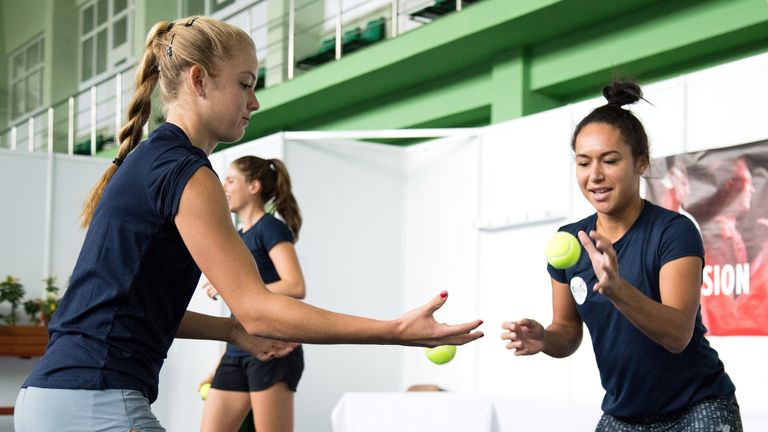 Katie Swan (L) and Heather Watson (R) warm up during a Great Britain Fed Cup training session at Tenis Club IDU on April 21, 2017 in Constanta, Romania. 