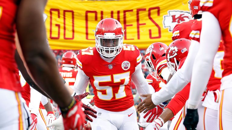 KANSAS CITY, MO - JANUARY 06:  Linebacker Kevin Pierre-Louis #57 of the Kansas City Chiefs is greeted by teammates during player introductions prior to the game against the Tennessee Titans at Arrowhead Stadium on January 6, 2018 in Kansas City, Missouri.  (Photo by Jamie Squire/Getty Images)