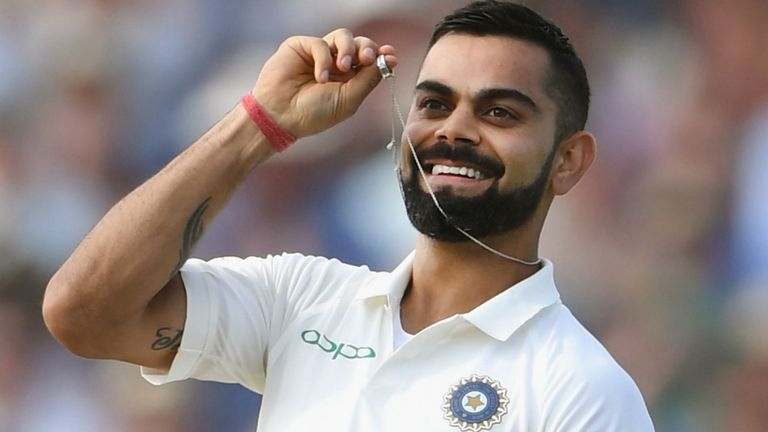 India batsman Virat Kohli celebrates his century by holding up his wedding ring during day two of the First Specsavers Test Match between England and India at Edgbaston on August 2, 2018 in Birmingham, England.