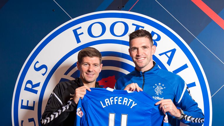 Kyle Lafferty poses with Rangers manager Steven Gerrard after signing on a two year contract from Hearts