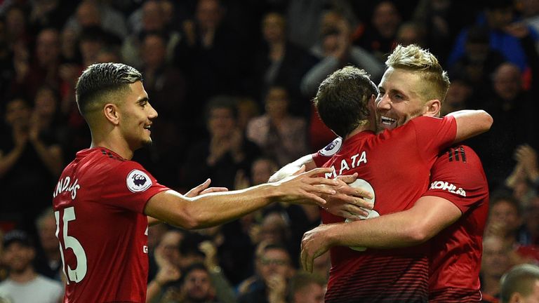 Luke Shaw celebrates his goal with teammates