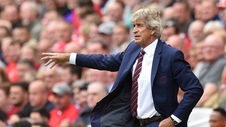 Manuel Pellegrini gestures on the touchline at Anfield