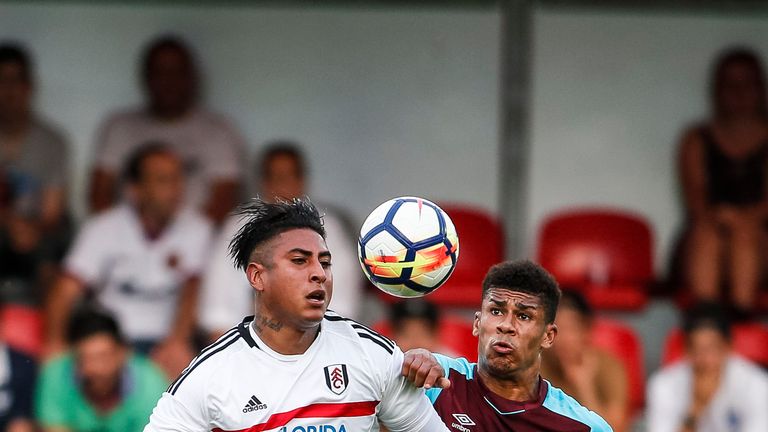 Marcelo Djalo (L) challenges Ashley Fletcher during the pre-season friendly between West Ham United and Fulham on July 20, 2017