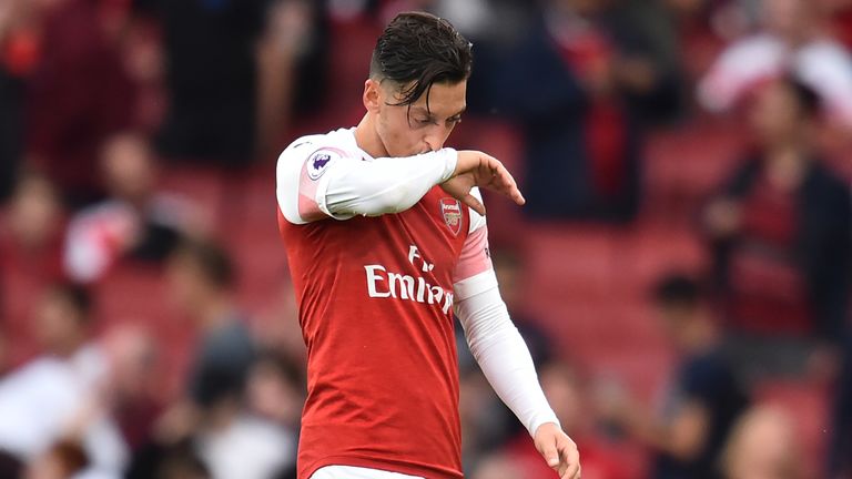 Mesut Ozil looks dejected after Arsenal's defeat to Manchester City