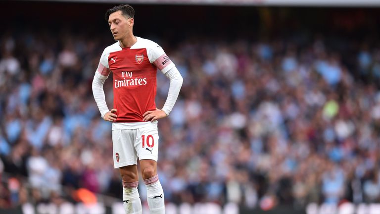 Mesut Ozil reacts during the 2-0 home defeat to current Premier League champions Manchester City