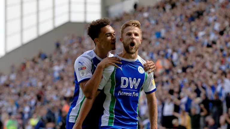 Wigan Athletic's Michael Jacobs (right) celebrates with teammate Antonee Robinson