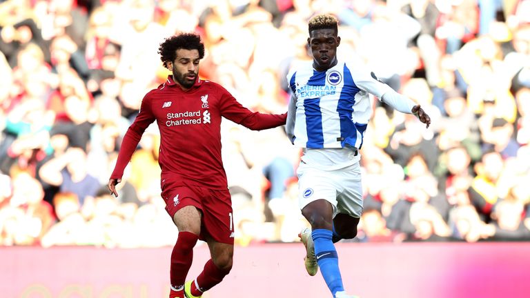 Brighton's Yves Bissouma battles for possession with Liverpool's Mohamed Salah