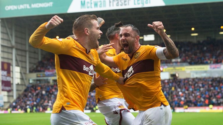 Motherwell&#39;s Peter Hartley (right) celebrates his late goal against Rangers with Chris Cadden.