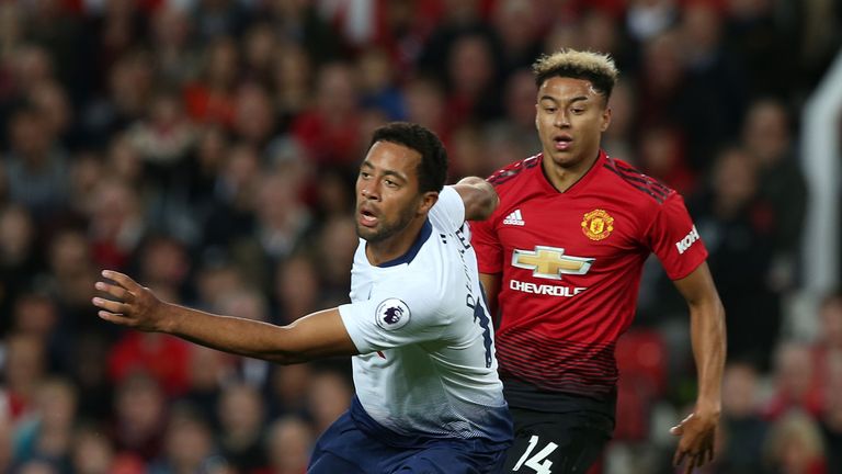 Mousa Dembele and Jesse Lingard battle for the ball 