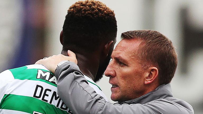 Moussa Dembele of Celtic is seen with Celtic manager Brendan Rodgers during the Betfred Scottish League Cup round of sixteen match between Partick Thistle and Celtic at Firhill Stadium on August 18, 2018 in Glasgow, Scotland.