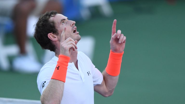 Andy Murray celebrates after defeating Kyle Edmund