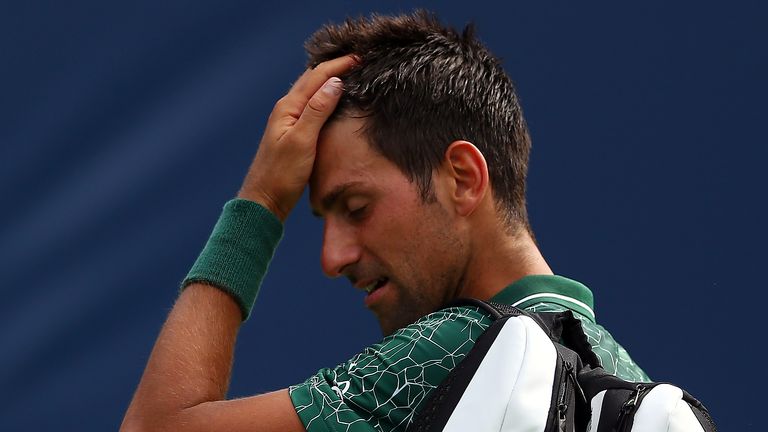 Novak Djokovic of Serbia walks off the court after being defeated by Stefanos Tsitsipas of Greece during a 3rd round match on Day 4 of the Rogers Cup at Aviva Centre on August 9, 2018 in Toronto, Canada. 