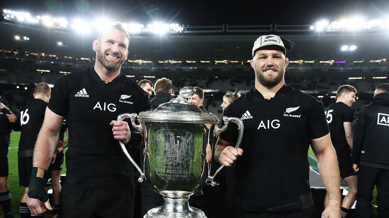 Owen Franks celebrates with Kieran Read and the Bledisloe Cup after their victory at Eden Park