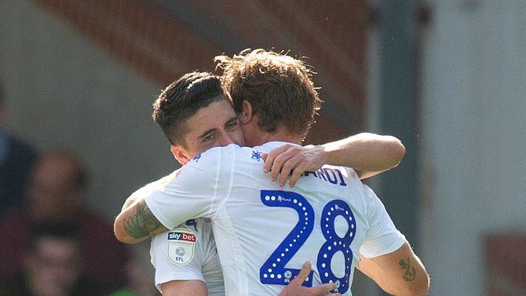 Leeds United's Pablo Hernandez (left) celebrates scoring his side's third goal at Carrow Road