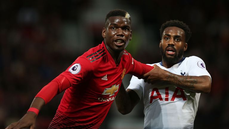 Danny Rose keeps a tight hold on Paul Pogba at Old Trafford