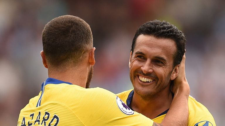 Pedro celebrates with Chelsea teammate Eden Hazard after making it 3-0