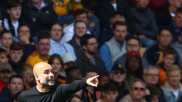 Pep Guardiola gives instructions during the 1-1 draw at Molineux