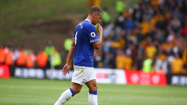 Phil Jagielka leaves the pitch after being sent off for a challenge on Diogo Jota