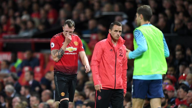 Phil Jones leaves the pitch after picking up an injury