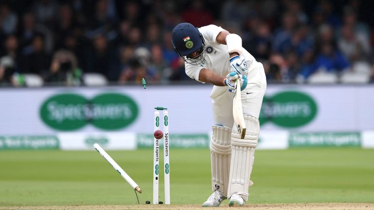 Cheteshwar Pujara's resistance was ended when he was bowled by Stuart Broad for 17 off 87 balls