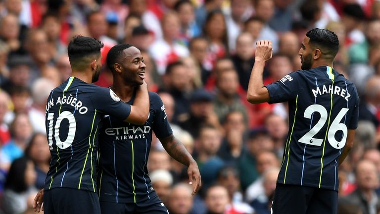 Raheem Sterling celebrates after scoring Manchester City's first goal