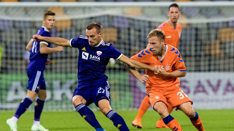 Rangers Scott Arfield (right) and J.Mesanovic in action