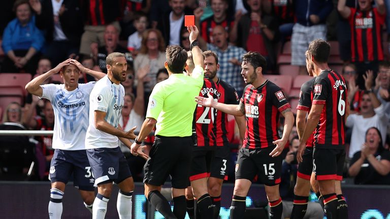 Richarlison is shown a red card by referee Lee Probert