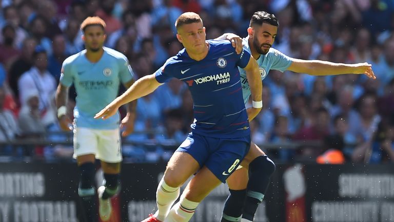 Ross Barkley holds off the challenge of Riyad Mahrez in the Community Shield 