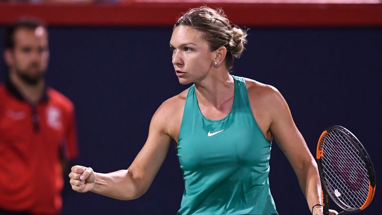 Simona Halep of Romania reacts after scoring a point against Venus Williams during day four of the Rogers Cup at IGA Stadium on August 9, 2018 in Montreal, Quebec, Canada