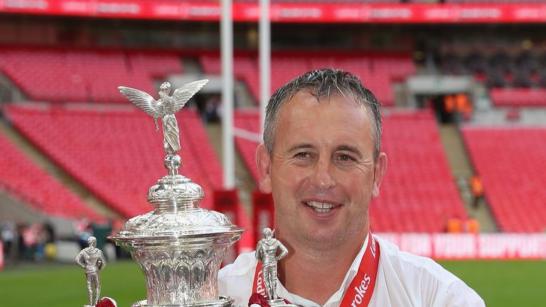 Steve McNamara - head coach of Catalans Dragons - poses with Challenge Cup trophy
