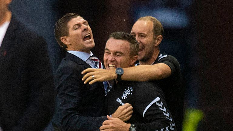 Steven Gerrera celebrates Rangers' opener with his coaching staff