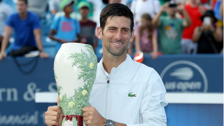 Novak Djokovic of Serbia poses with the winner&#39;s trophy after defeating Roger Federer of Switzerland during the men&#39;s final of the Western & Southern Open at Lindner Family Tennis Center on August 19, 2018 in Mason, Ohio.