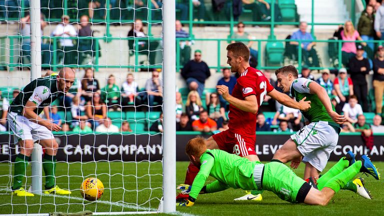 Aberdeen's Tommie Hoban forces home the opener